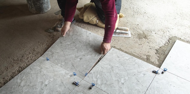 laying-floor-ceramic-tile-renovating-floor_220873-13106